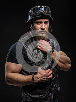 Portrait Handsome Bearded Biker Man in Leather Jacket and Helmet