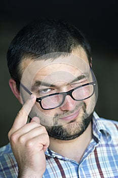 Portrait of handsome bearded intelligent modern photogenic young