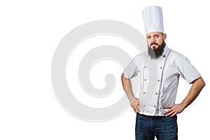 Portrait of handsome bearded male chef in uniform hands on waist isolated on white background, copy space on side.