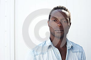 Portrait of a handsome black man against white background