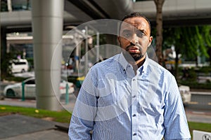 Portrait of handsome black man in city ready for business