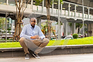 Portrait of handsome black man in city ready for business