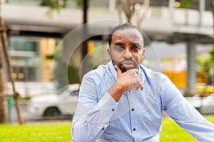 Portrait of handsome black man in city ready for business