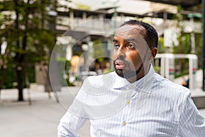 Portrait of handsome black man in city ready for business