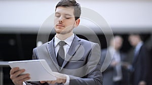 Portrait of handsome businessman on blurred office background