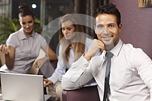 Portrait of handsome businessman in lobby