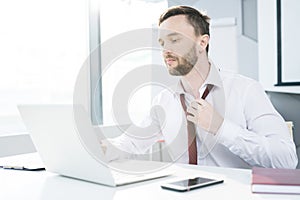 Businessman Loosening Tie