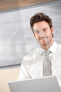 Portrait of handsome businessman smiling