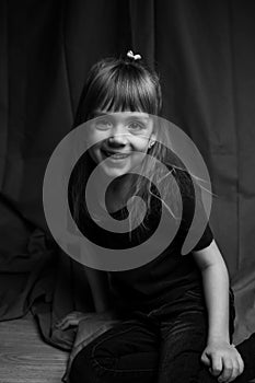 Portrait of handsome caucasian girl. Cute little girl smiling portrait in black and white