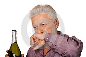 Portrait of handsome caucasian man drinking on white background