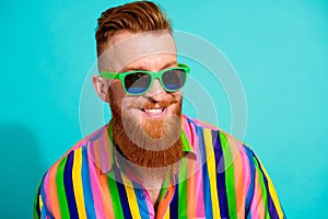 Portrait of handsome cheerful boyfriend in hipster shirt toothy smiling wear sunglasses rayban brand isolated on cyan photo