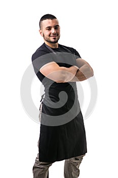 Portrait of handsome chef in black apron