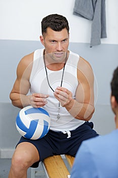 portrait handsome coach talking to sportsman