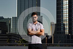 Portrait of handsome confident man in city. Portrait of confident man in modern big american city. Stylish lambersexual