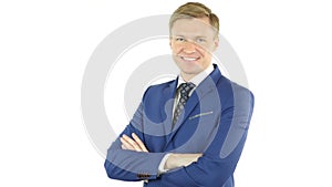 Portrait of handsome confident young businessman standing arms crossed, smiling