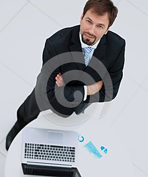 Portrait of a handsome elderly business man standing isolated on