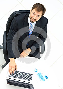 Portrait of a handsome elderly business man standing isolated on