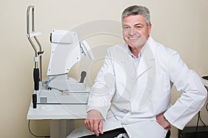 Portrait of handsome elderly eye doctor