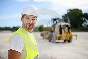 Portrait of handsome foreman construction worker on industrial building industry construction site
