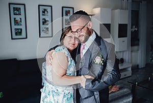 Portrait of a handsome groom with his mother