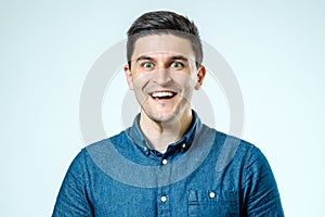 Portrait of handsome guy smiling at camera