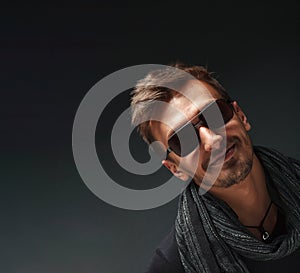 Portrait of a handsome guy, wearing sunglasses