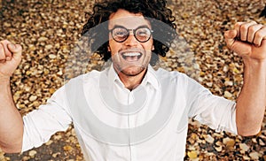 Portrait of handsome happy young man smiling broadly posing for advertisement, smiling and looking at the camera. Happy student