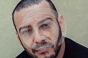 Portrait of a handsome Italy man face outdoors