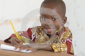 Portrait of handsome little African Black Boy Learning to Write