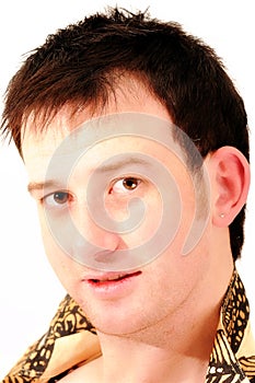 Portrait of handsome male model with earring smili