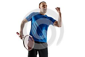 Portrait of a handsome male tennis player celebrating his success isolated on a white background