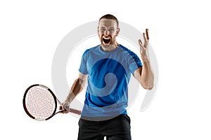 Portrait of a handsome male tennis player celebrating his success isolated on a white background