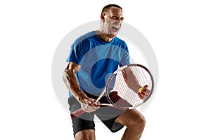 Portrait of a handsome male tennis player celebrating his success isolated on a white background