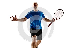 Portrait of a handsome male tennis player celebrating his success isolated on a white background