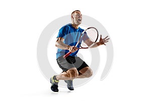 Portrait of a handsome male tennis player celebrating his success isolated on a white background