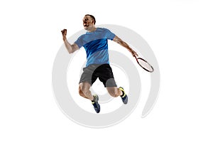 Portrait of a handsome male tennis player celebrating his success isolated on a white background