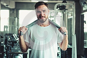 Portrait of Handsome Man is Exercising in Fitness Club.,Portrait of Strong Man Doing Working Out Calories Burning in Gym., Healthy