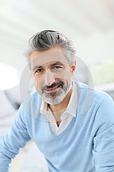 Portrait of handsome man at home