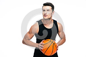 Portrait of a handsome man playing in basketball