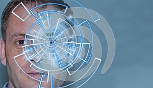 Portrait of handsome man with tech pattern on eye. Digital ID concept, eye recognition