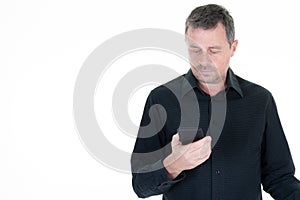 Portrait handsome man texting looking holding mobile cell phone in white background