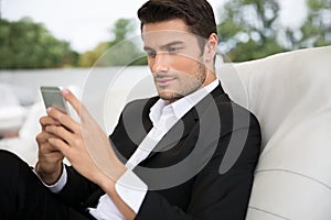 Portrait of a handsome man using smartphone