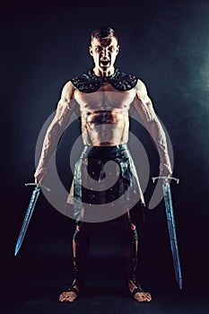 Severe barbarian in leather costume with sword