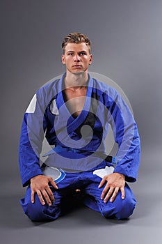 Portrait of Handsome Muscular Jiu Jitsu Fighter Posing. photo
