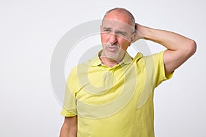 Seniors portrait of contemplative old caucasian man looking at camera. Copy space