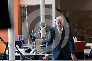 Portrait of handsome senior business man at modern office