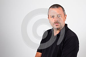 Portrait handsome of serious arms crossed mature man on grey background