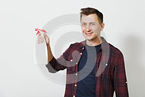 Portrait of handsome serious caucasian young man isolated on white background. Copy space for advertisement. With place for text.