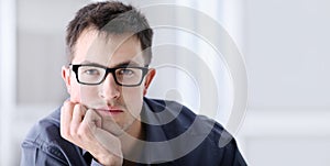 Portrait of handsome serious and reliable man with spectacles photo