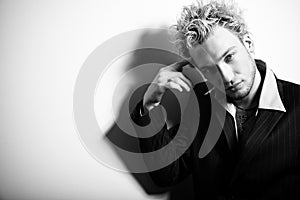 Portrait of handsome stylish blond man in suit